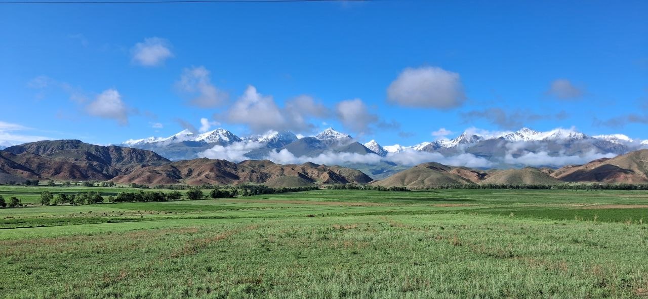 Dramatic mountain peaks and alpine lake in Kyrgyzstan